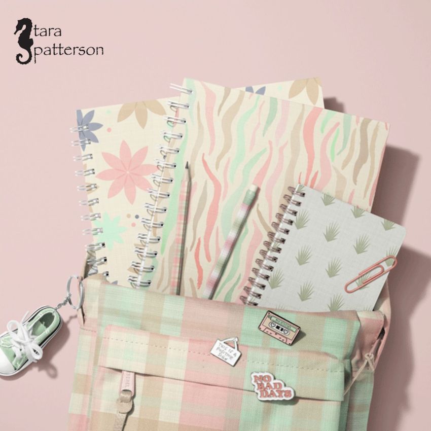 School backpack mockup with pastel plaid fabric, spiral notebooks in soft patterns, and small pins on a pink background.