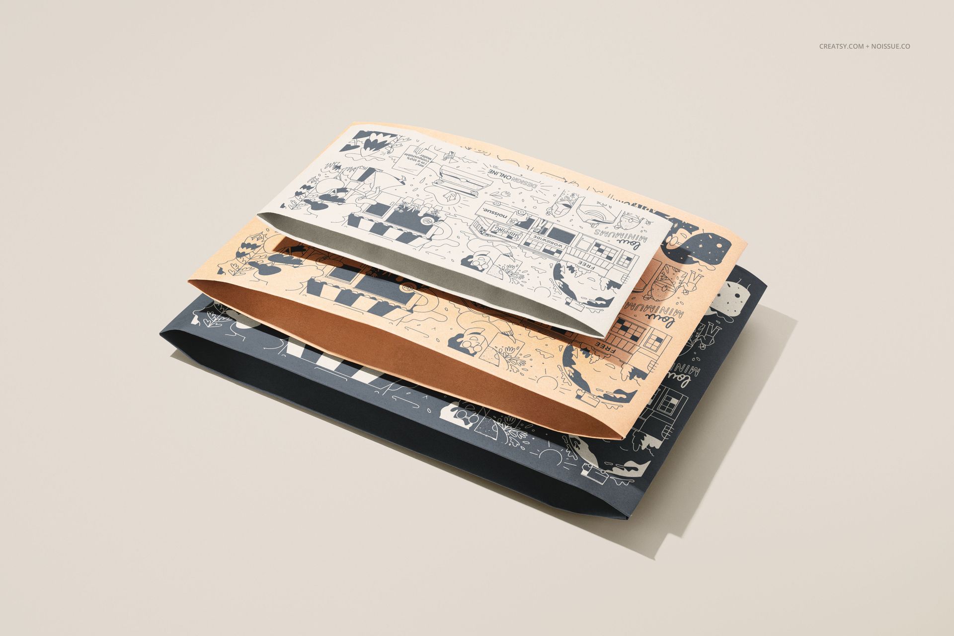 PSD mockup of kraft mailer packaging with assorted graphic prints, viewed from above with soft shadows and minimal props.