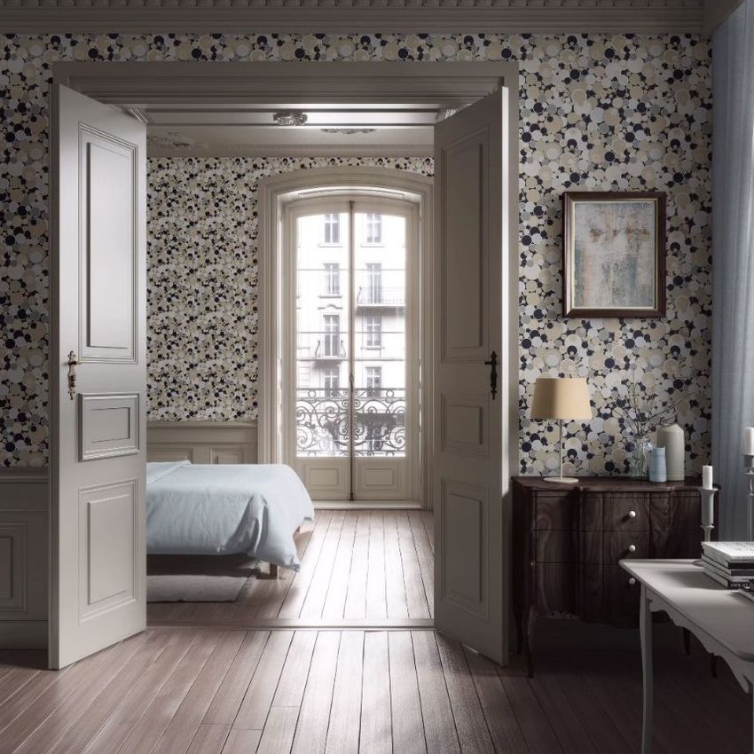 Apartment wallpaper mockup showing a room with beige and navy geometric patterned wallpaper, open double doors, and a view into a bedroom.