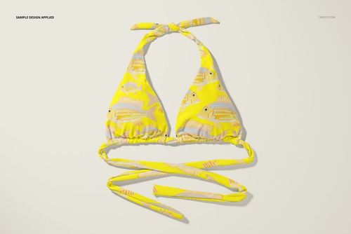 High waisted bikini top mockup with yellow fabric featuring a fish pattern, displayed from a top-down perspective.