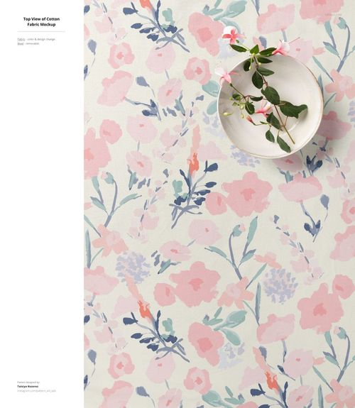 Cotton fabric mockup featuring soft pink and blue floral designs, shown from above with a bowl and decorative foliage.