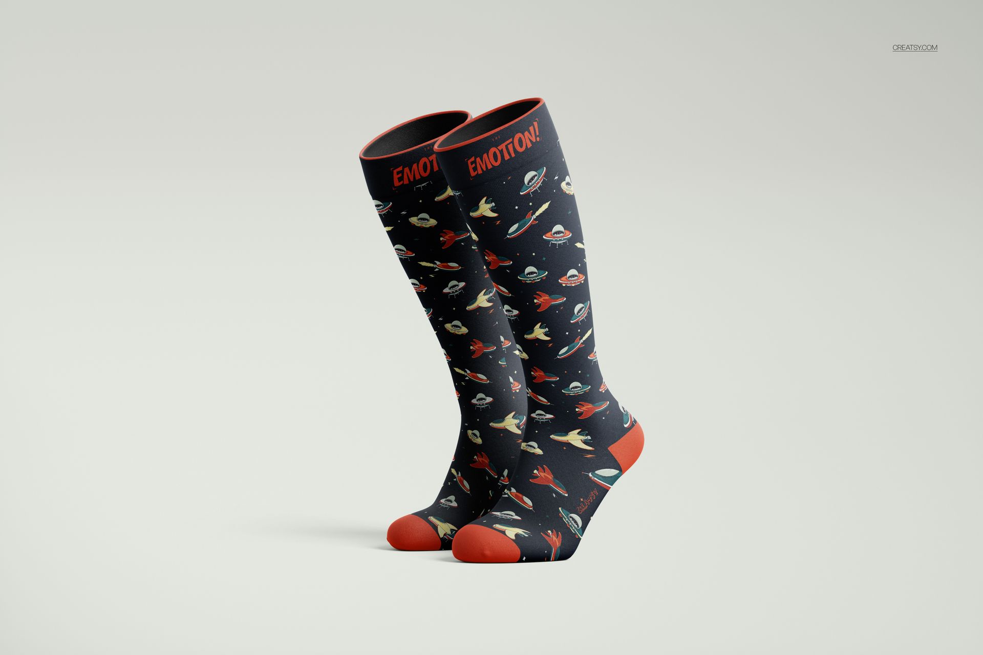 Front view of over the calf socks mockup featuring a dark background with colorful space-themed patterns and red accents.