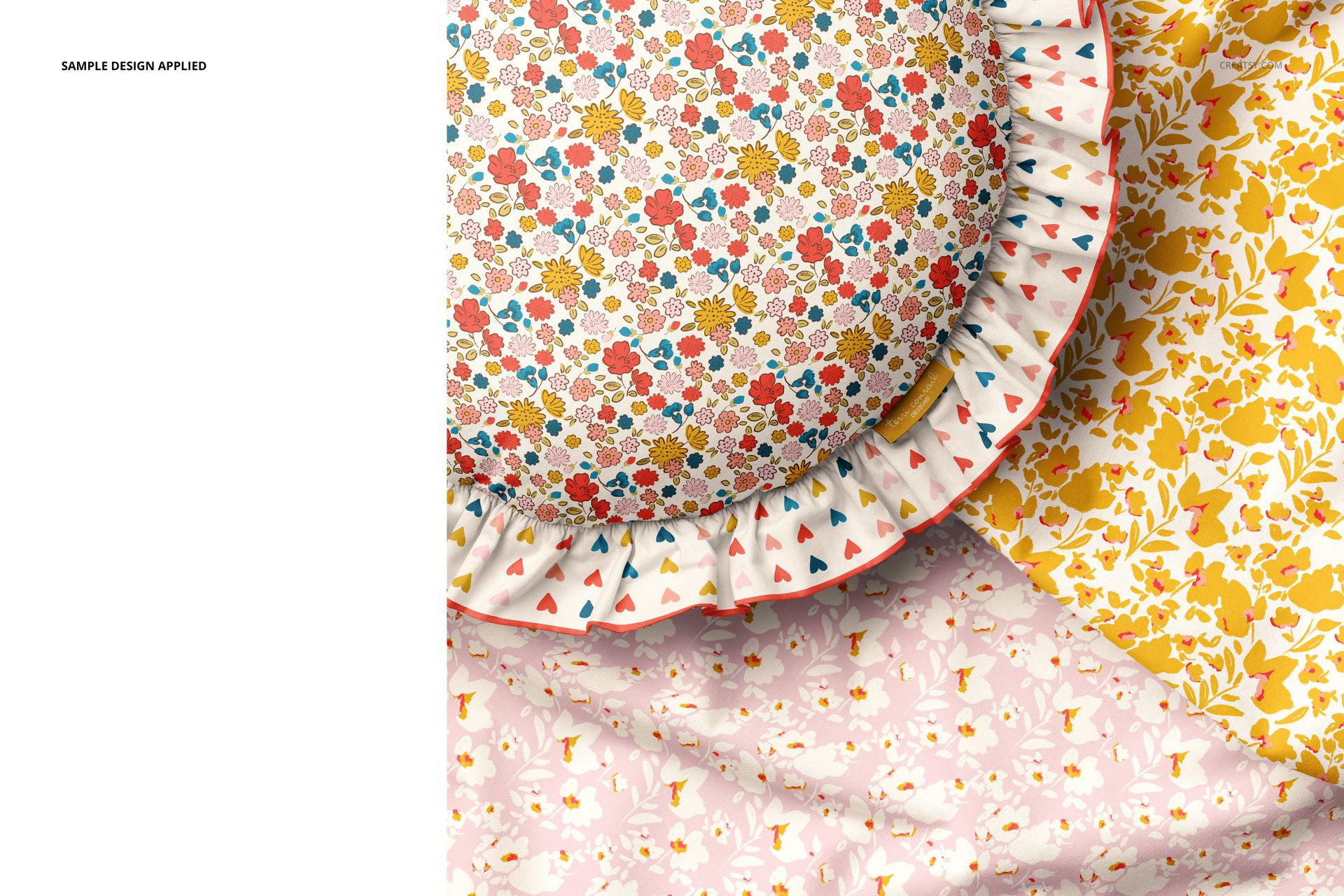 Round ruffled pillow mockup with multicolor flower print, displayed with yellow and pink patterned textiles.