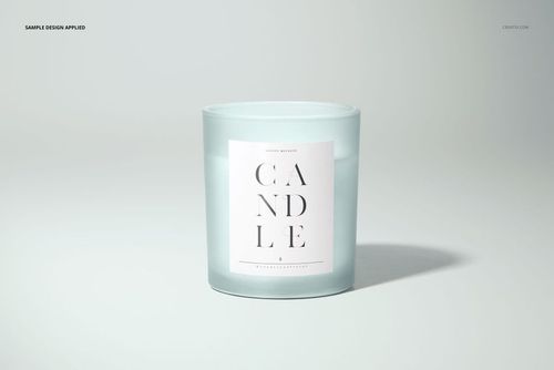 Frosted glass candle with a white paper label, centered on a light background, front view mockup.