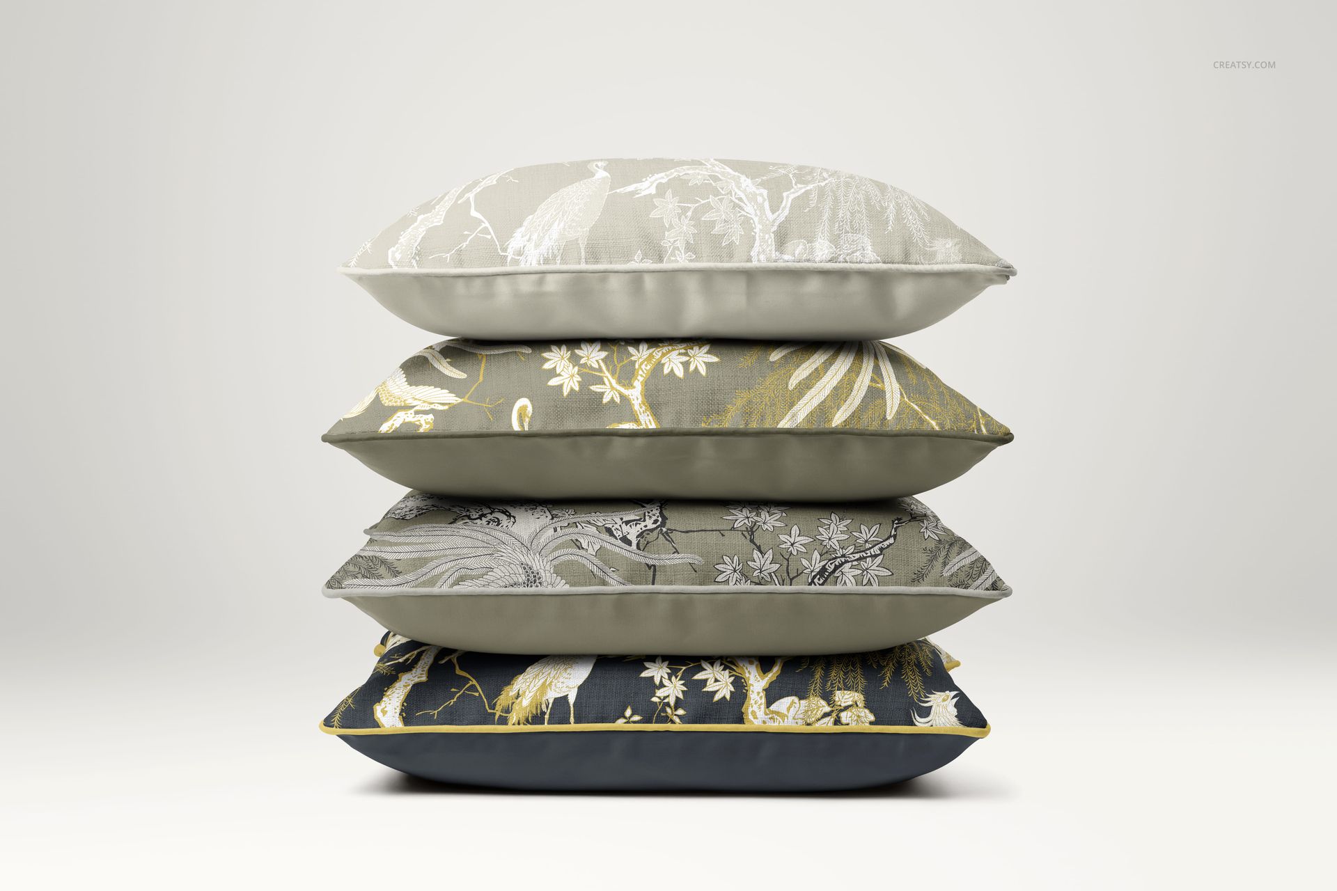 PSD mockup featuring a side perspective of stacked cushions with various floral and wildlife motifs in earthy tones.