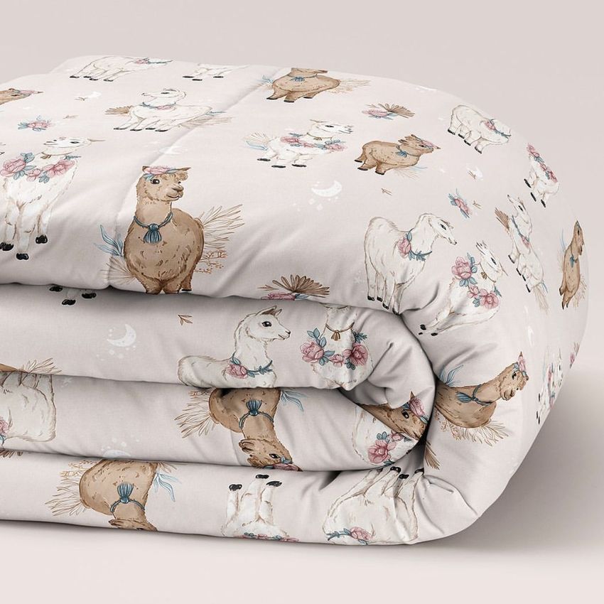 Microfiber comforter mockup featuring a folded blanket with a whimsical alpaca pattern on a light beige background.