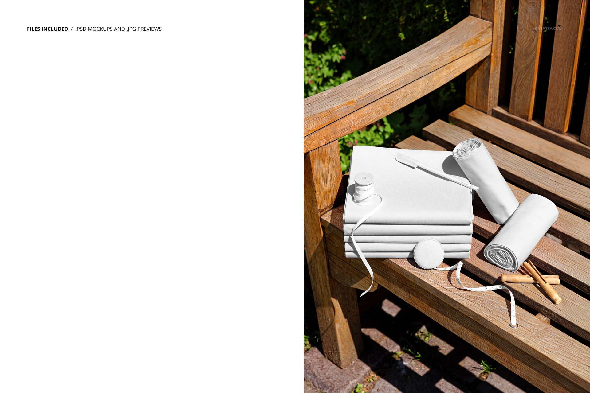 PSD mockup showing fabric rolls and a folded fabric stack placed on a wooden bench in a sunlit garden setting.