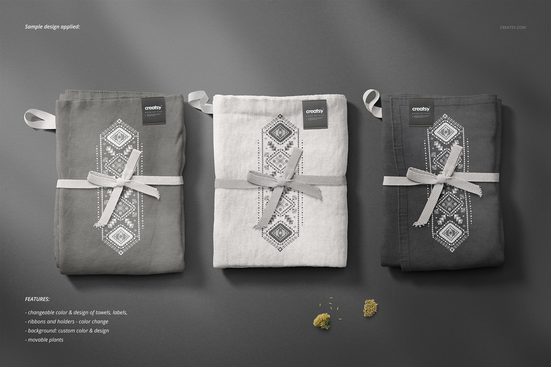 Kitchen towels mockup showing three folded towels in neutral colors, arranged side by side with decorative ribbons and labels.