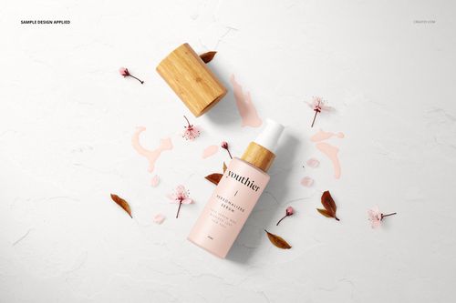 Front view of a cosmetic bottle mockup with a wooden lid, pink floral accents, and scattered leaves on a light background.