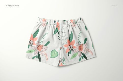 Front view of baby and kids shorts mockup with a white base and colorful floral pattern, displayed on a plain background.