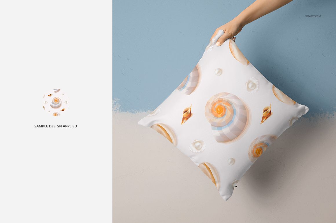 Mockup of a square pillow featuring a soft pastel seashell design, displayed in a home setting with a painted wall.