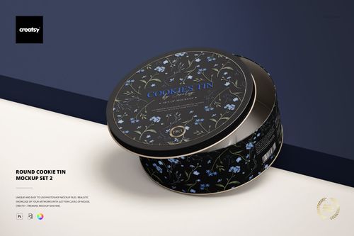 Round cookie tin with dark floral pattern, shown in a mockup scene with lid slightly open, angled front view.