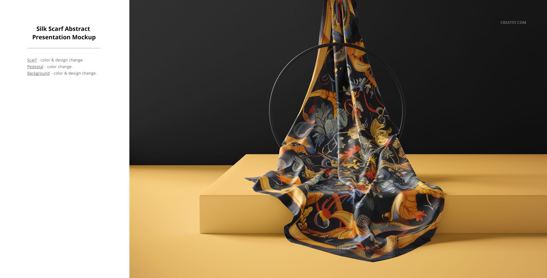 Silk fabric mockup displayed on a yellow surface, showing a flowing abstract design with orange, blue, and black tones.