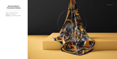 Silk fabric mockup displayed on a yellow surface, showing a flowing abstract design with orange, blue, and black tones.
