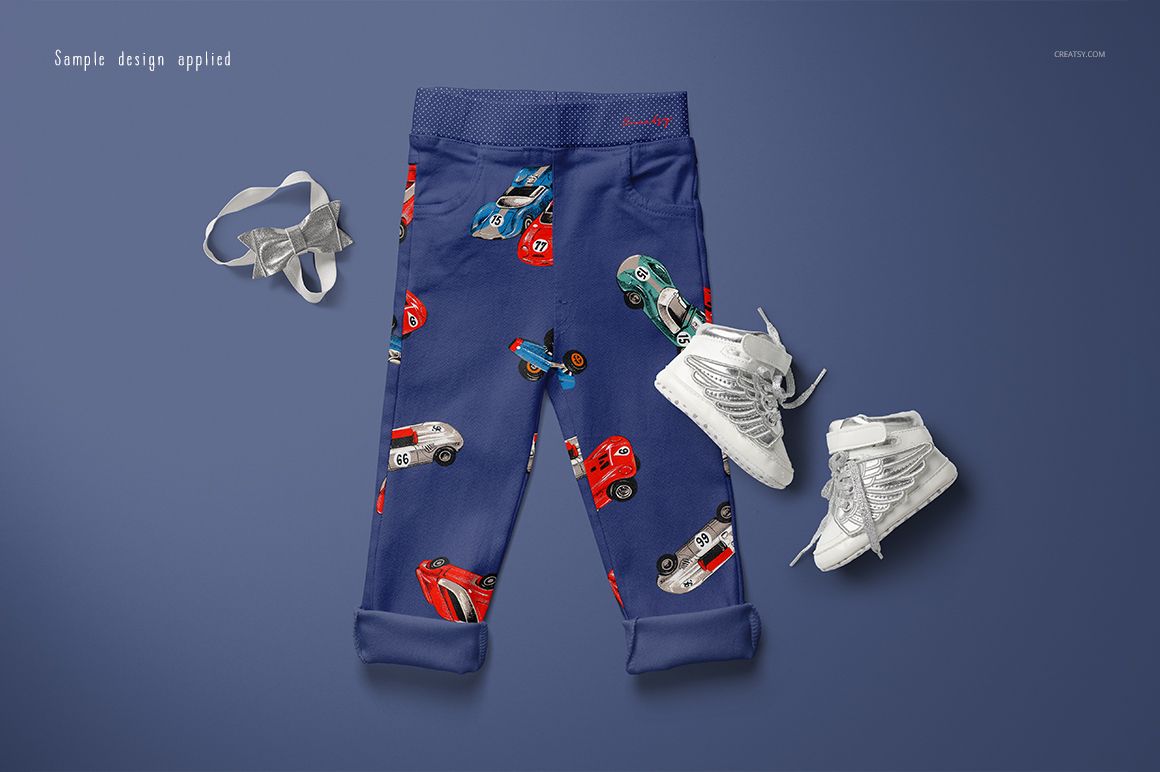 Kids trousers mockup featuring blue pants with colorful car illustrations, shown from above with shoes and a headband.