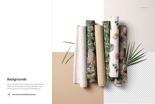 PSD mockup showing multiple fabric rolls with different nature-inspired designs, placed on a neutral two-tone surface.