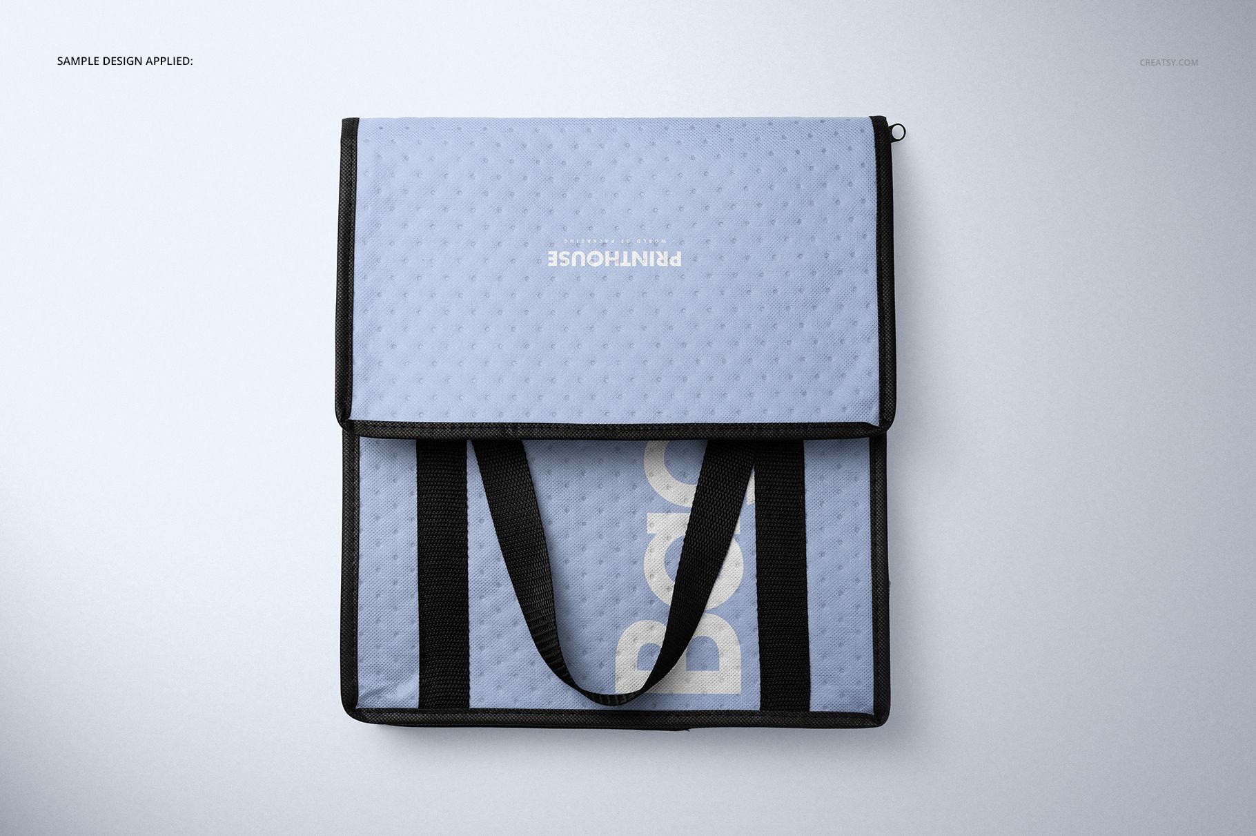 Front view of a rectangular insulated cooler bag mockup in light blue with black handles and a textured surface.