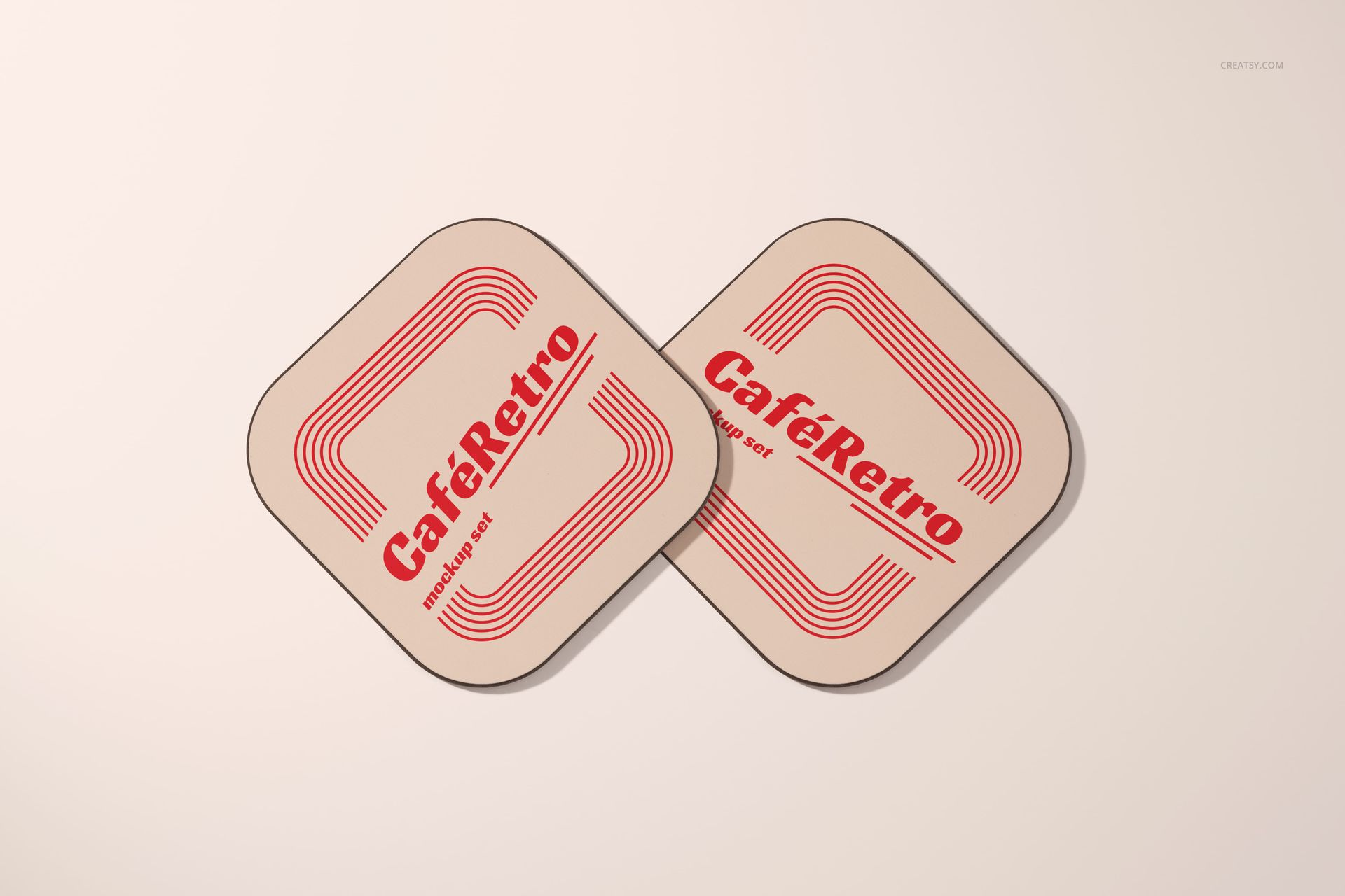PSD mockup of two square coasters with curved corners and bold red text, arranged side by side.