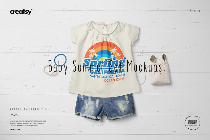 Front view of a baby summer outfit mockup with a cream t-shirt featuring a colorful beach graphic, denim shorts, and a small bag on a light background.