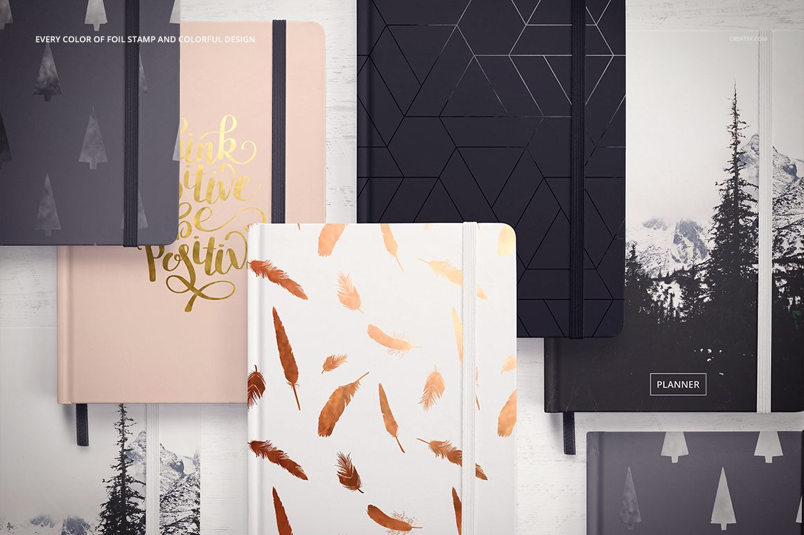 Stationery mockup set displaying six planners with different patterns and colors, shown from above on a white background.