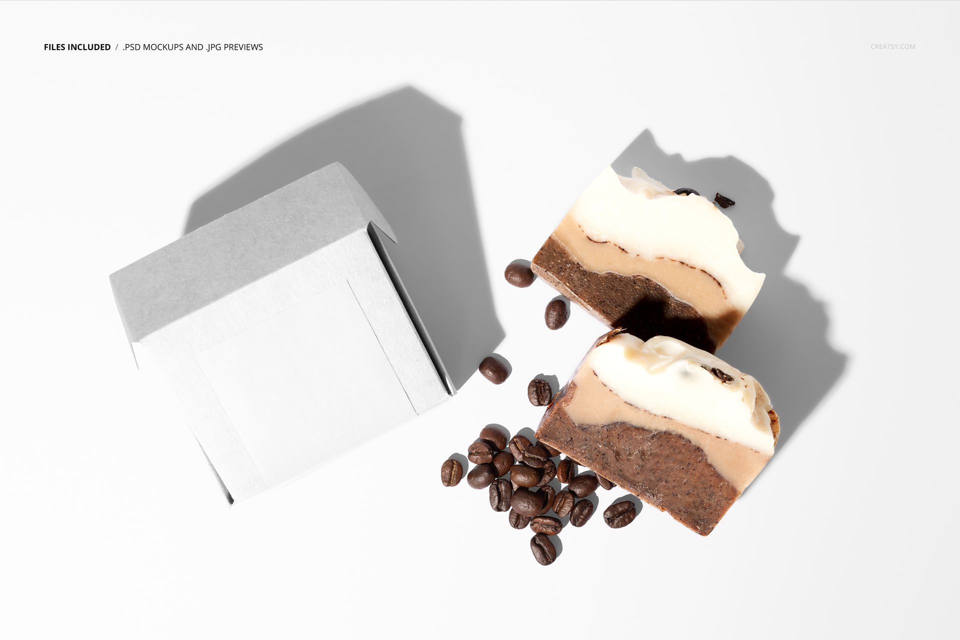 Coffee soap box and two coffee soap bars with coffee beans on a white surface, shown in a top view mockup scene.
