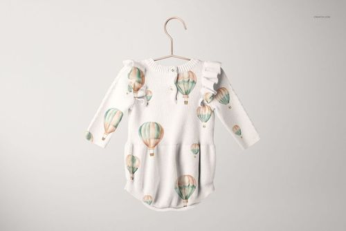 Knitted baby romper mockup featuring long sleeves, ruffled shoulders, and pastel hot air balloons, suspended on a hanger.