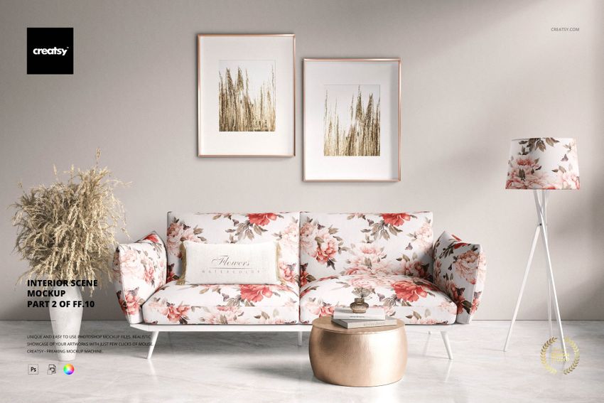 Interior scene mockup featuring a floral sofa, decorative pillow, gold coffee table, and two framed prints on the wall.