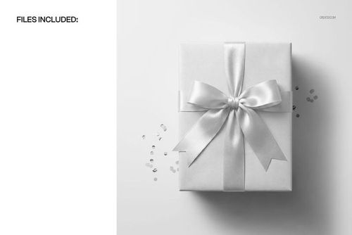 PSD mockup featuring a wrapped gift box with a large satin bow, surrounded by small confetti pieces.