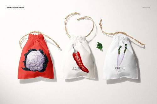 Linen drawstring pouch PSD mockup set with three bags in red, off-white, and white, each with a unique vegetable print.
