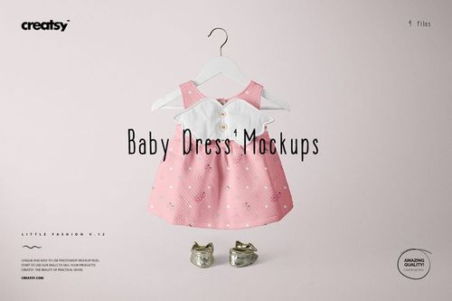 Pink baby dress mockup featuring white collar and button details, shown hanging with gold shoes on a light background.