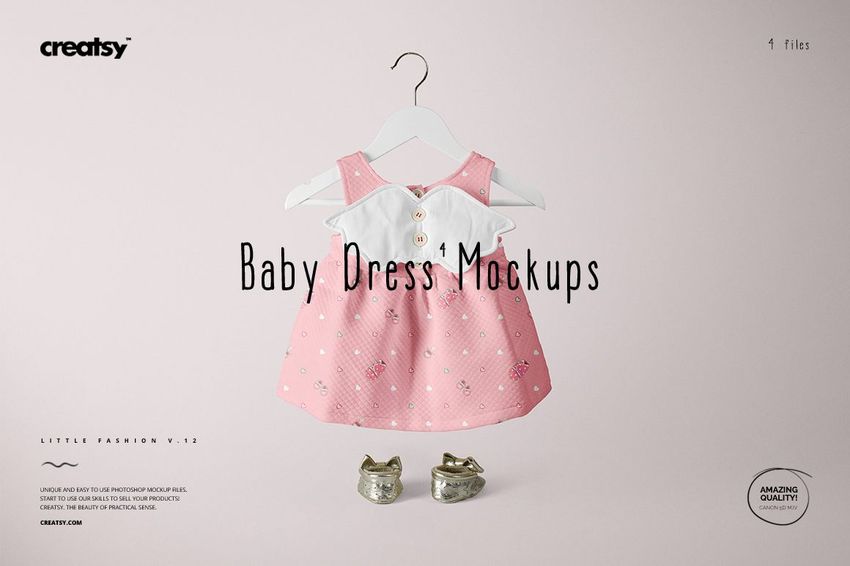 Pink baby dress mockup featuring white collar and button details, shown hanging with gold shoes on a light background.