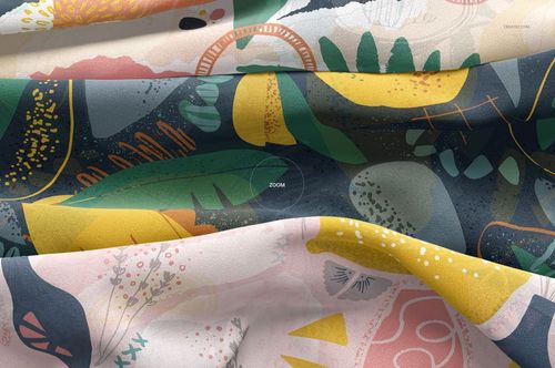 Detailed close-up of silk textile mockup featuring overlapping layers with multicolored abstract designs and soft folds.