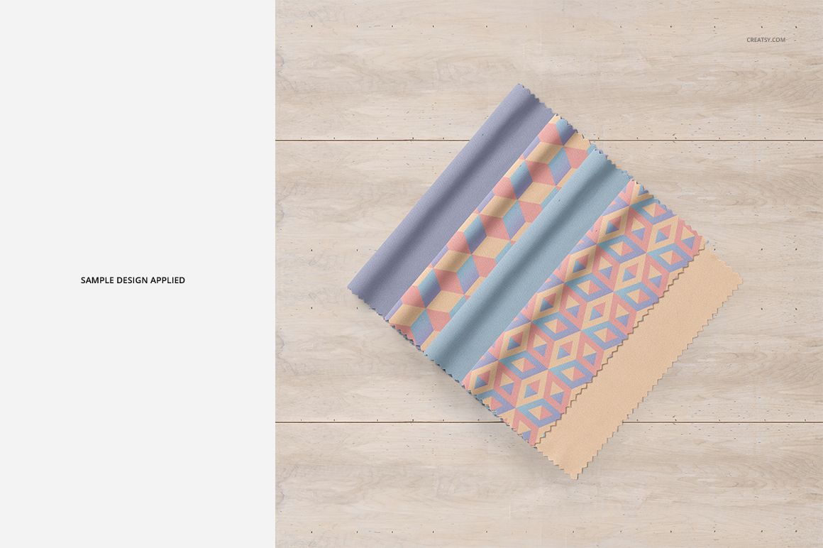 PSD mockup of square microfiber cleaning cloths displaying soft geometric patterns, laid flat on wooden boards.