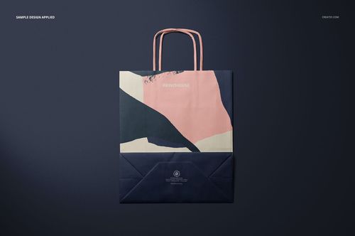 Twisted handles paper bag mockup shown from above, decorated with geometric shapes in pink, navy, and beige tones.