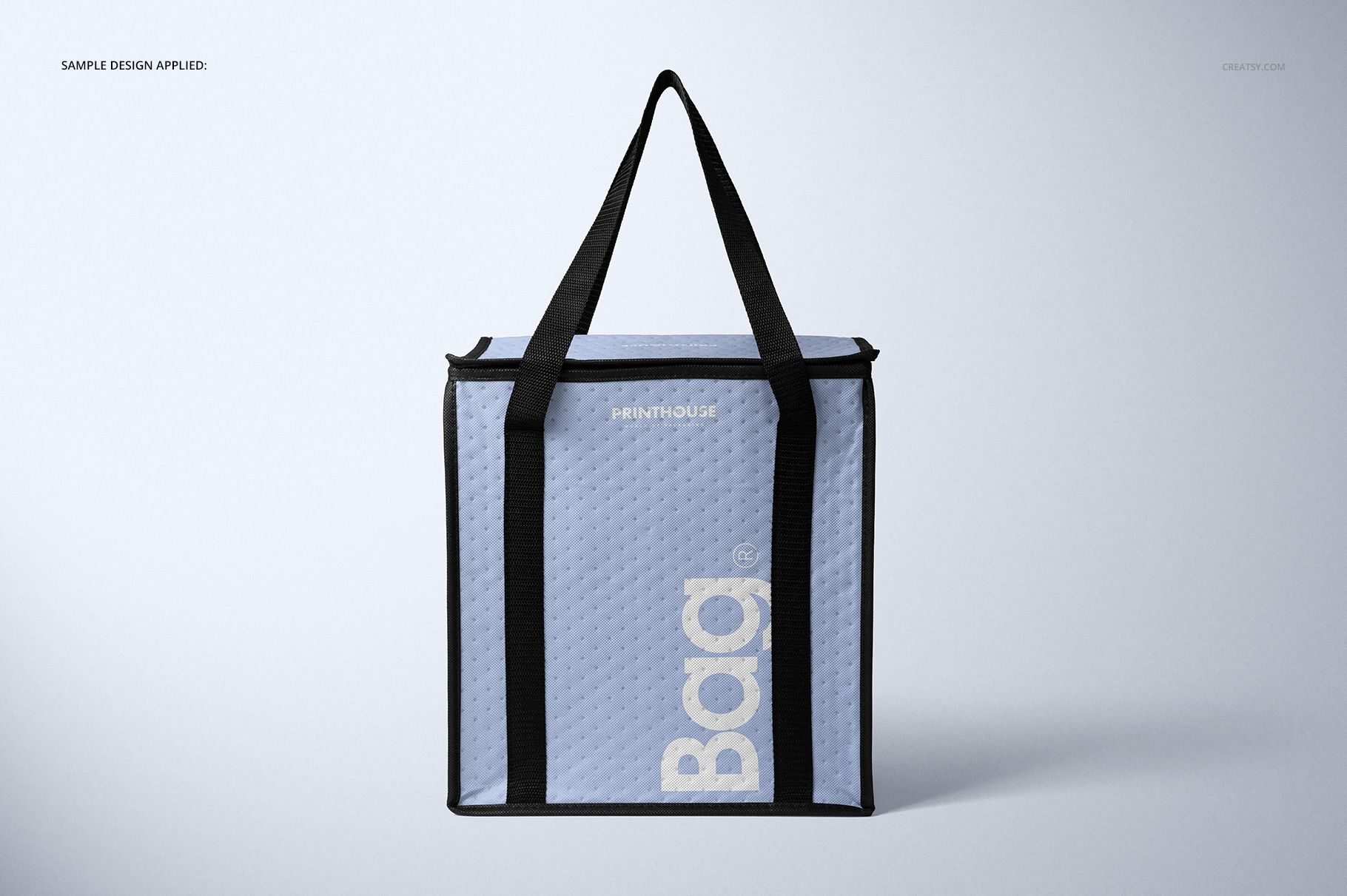 Front view of a square insulated cooler bag mockup with black handles, light blue body, and subtle textured pattern.