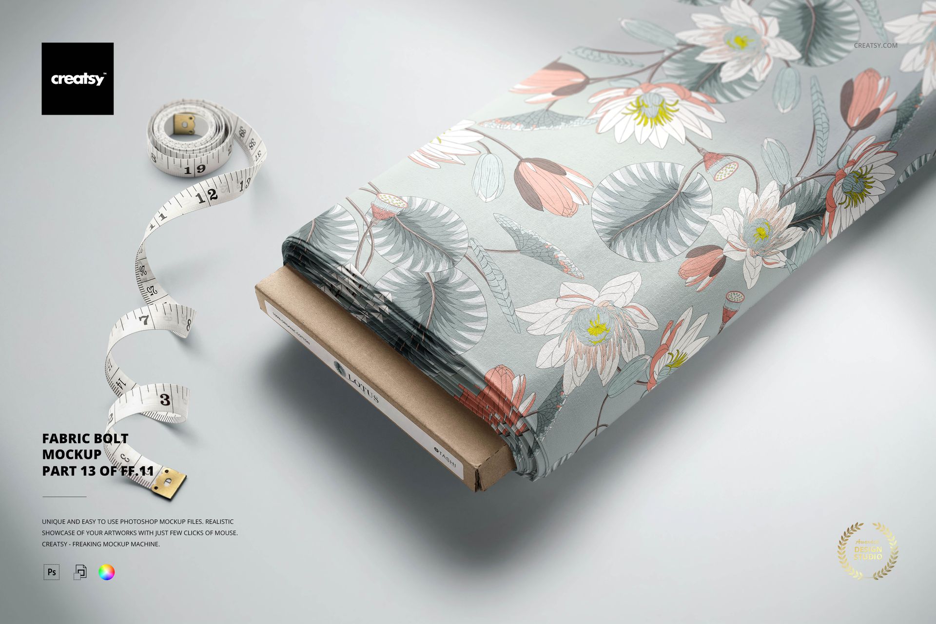 Floral patterned fabric bolt mockup in soft gray tones, shown diagonally with a tape measure on the surface.