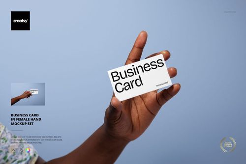 PSD mockup showing a business card in a woman's hand, minimal design, light blue background.