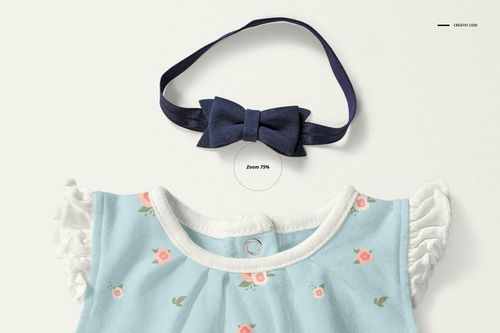 Front view of a baby dress mockup with light blue fabric, small pink floral pattern, white ruffled sleeves, and a navy bow headband.