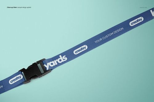 Polyester lanyard mockup featuring a blue strap with white branding, black buckle, and turquoise backdrop.