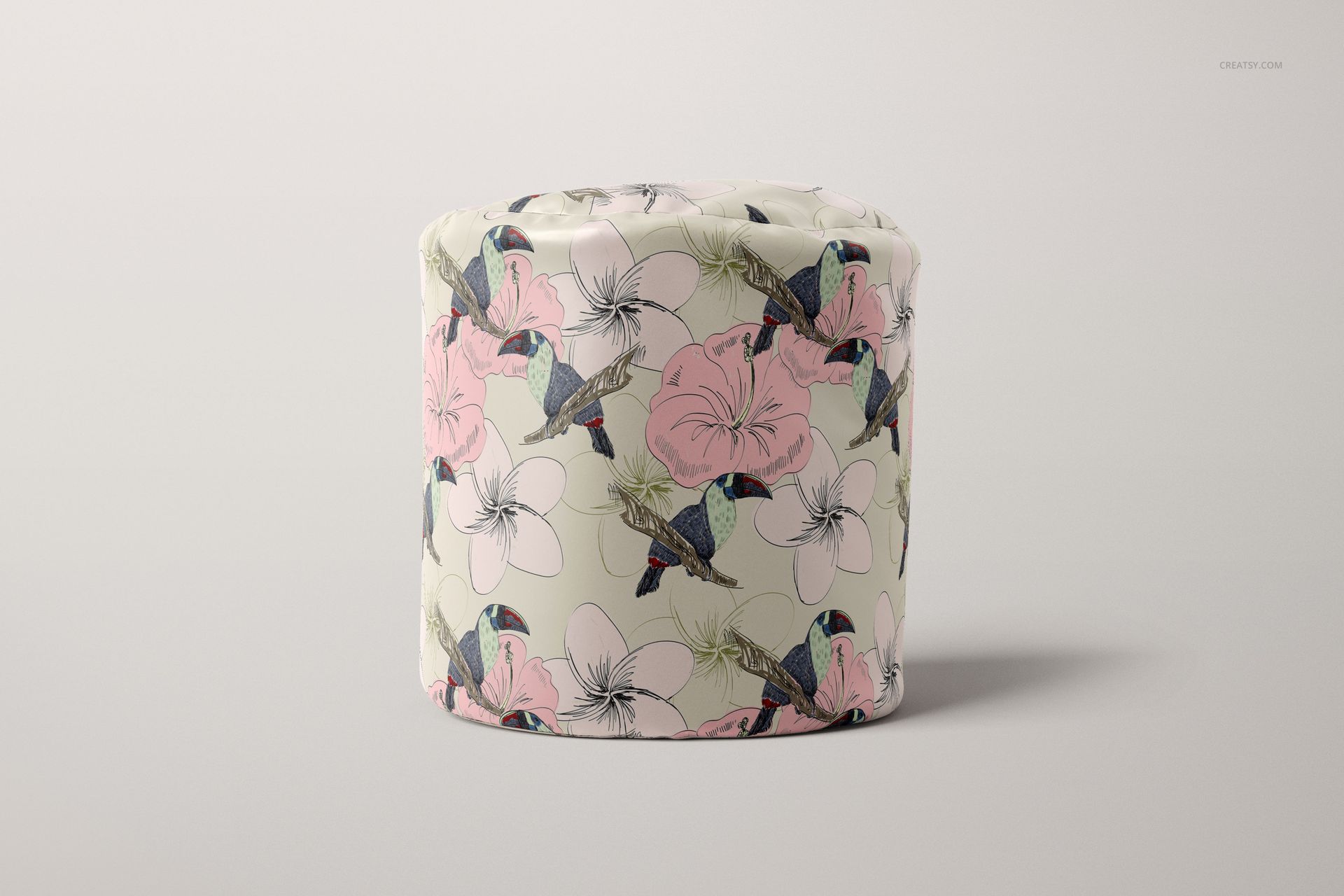 PSD mockup of a round bean bag with illustrated birds and flowers in soft tones, displayed on a light background.