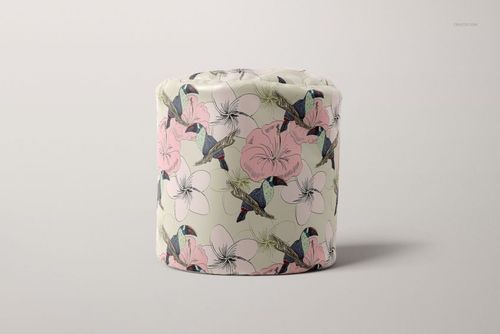 PSD mockup of a round bean bag with illustrated birds and flowers in soft tones, displayed on a light background.