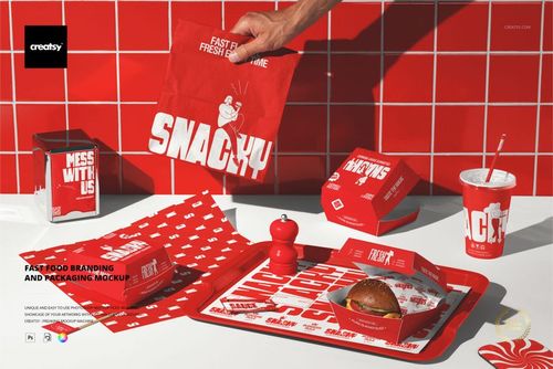 Burger packaging and branding mockup featuring red containers, paper, and tray with bold white text, top view.