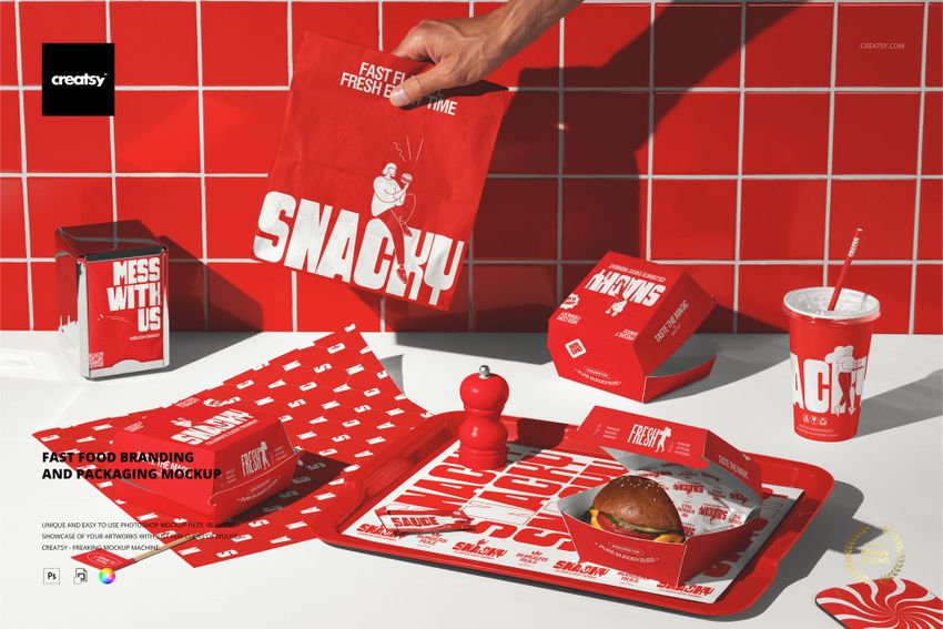 Burger packaging and branding mockup featuring red containers, paper, and tray with bold white text, top view.