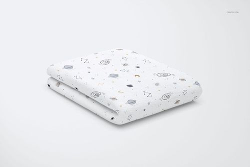 Kids bed sheet PSD mockup, folded and decorated with cartoon space motifs, set against a clean, minimal background.