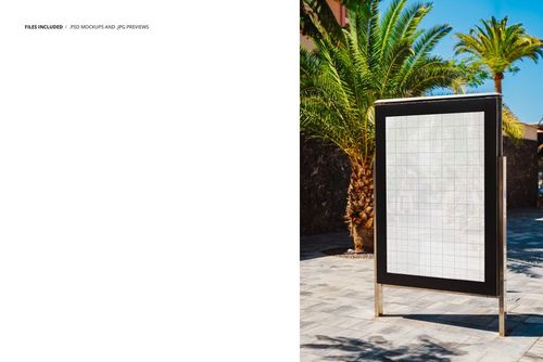 Outdoor poster mockup displayed on a metal stand, surrounded by palm trees and stone pavement in sunlight.