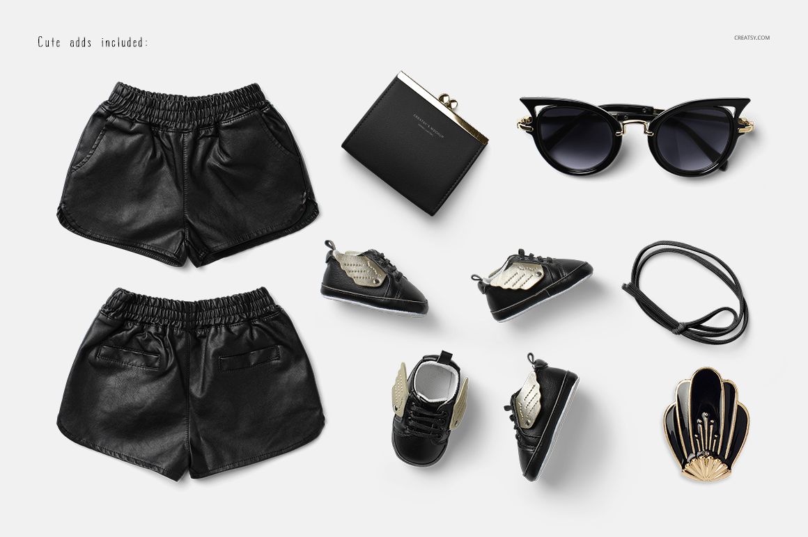 PSD mockup featuring baby clothing and accessories such as black shorts, shoes, and sunglasses on a plain surface.