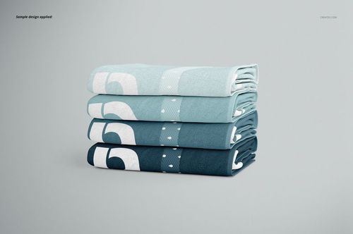 Bath towel PSD mockup set with layered towels in blue gradients and simple patterns, viewed from the side on a neutral surface.