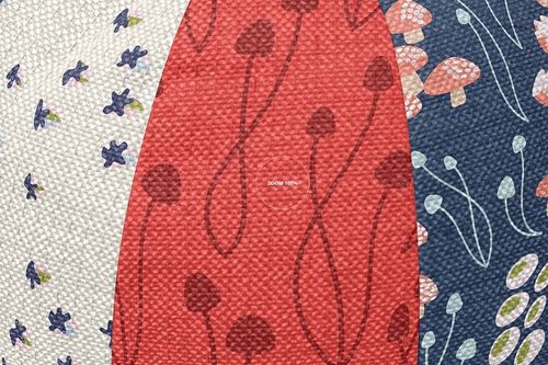 Detailed view of sphere pillow mockup set showing three pillows with colorful mushroom and floral designs on textured fabric.