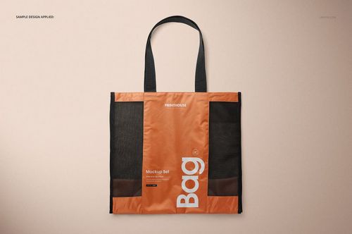 Front view of a mesh shopping tote bag mockup featuring black mesh sides, orange center, and black handles.