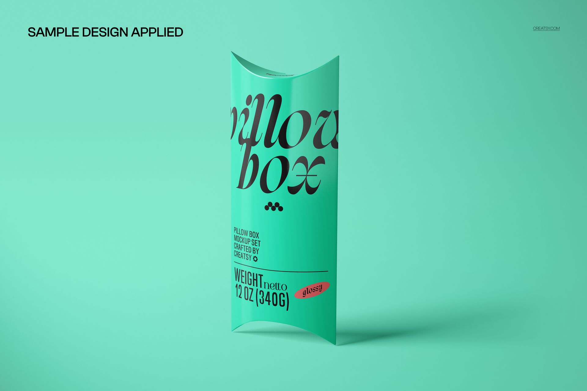 PSD mockup featuring a pillow box in turquoise color with prominent black lettering, shown on a plain background.